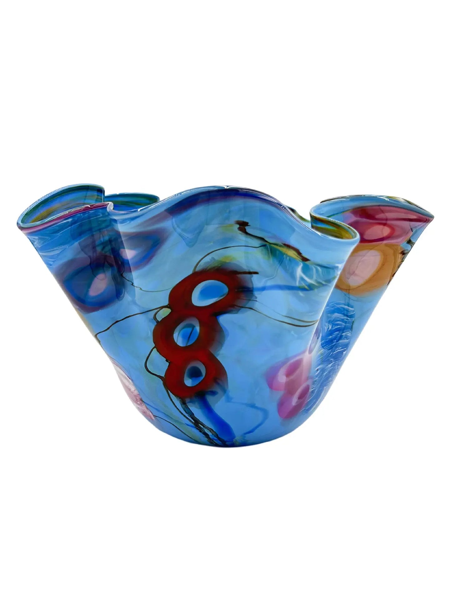 Ocean Song by Steve Palmer is a handcrafted glass bowl inspired by underwater life, featuring ruffled edges and a sky-blue base with vibrant abstract red, orange, pink, and deep blue patterns, conveying movement and energy. Measures approximately 13" wide, 9" high, and weighs 6.15 lbs.