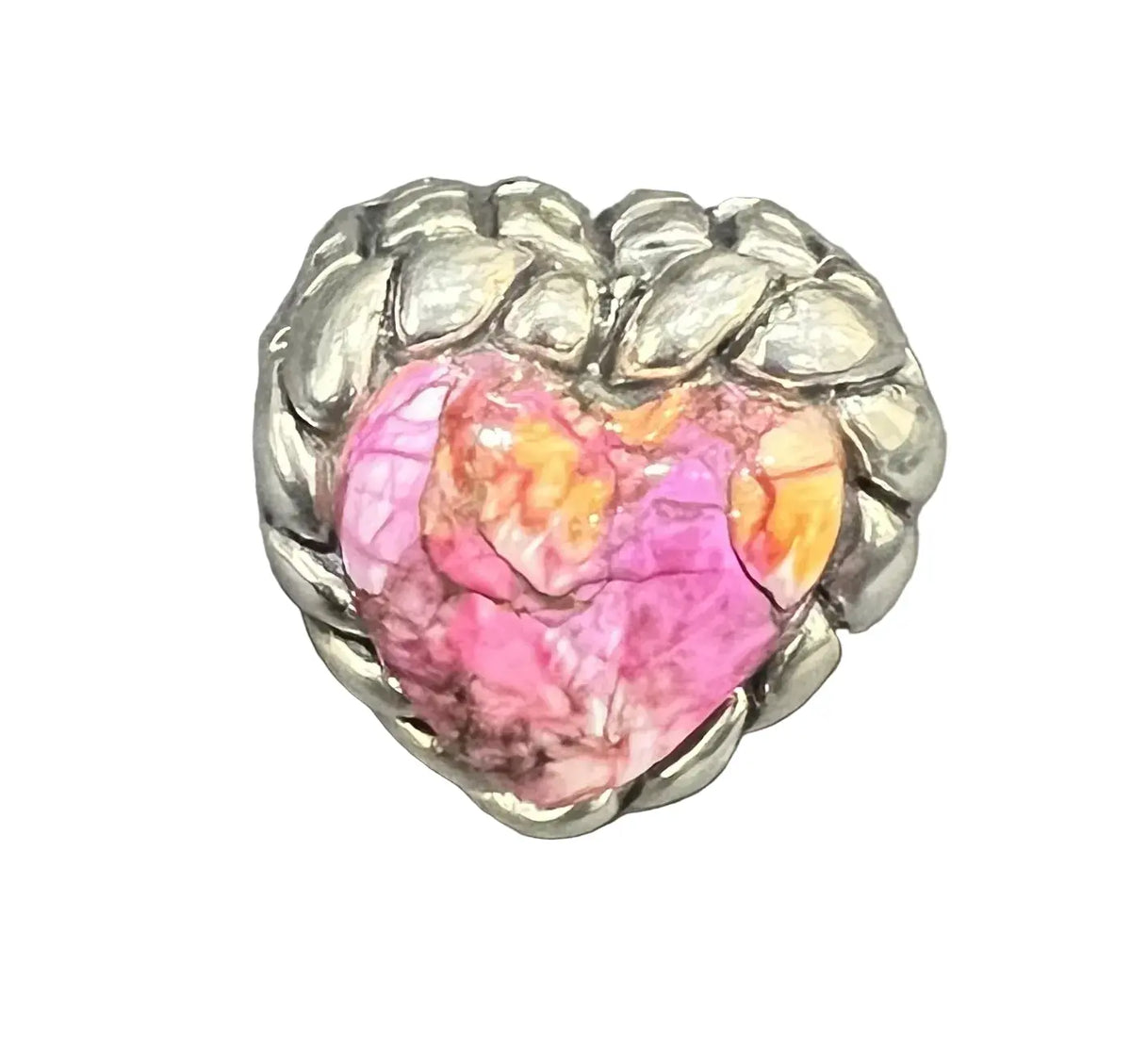 A heart-shaped ring featuring a vibrant pink and orange marbled stone in the center, surrounded by a textured silver band with leaf-like details.
