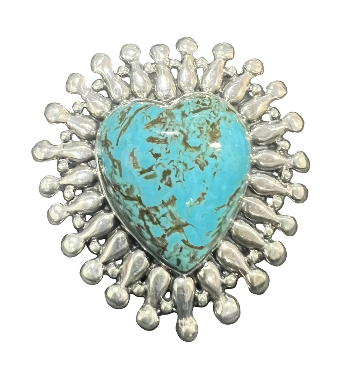 A heart-shaped turquoise stone ring surrounded by a silver sunburst halo.