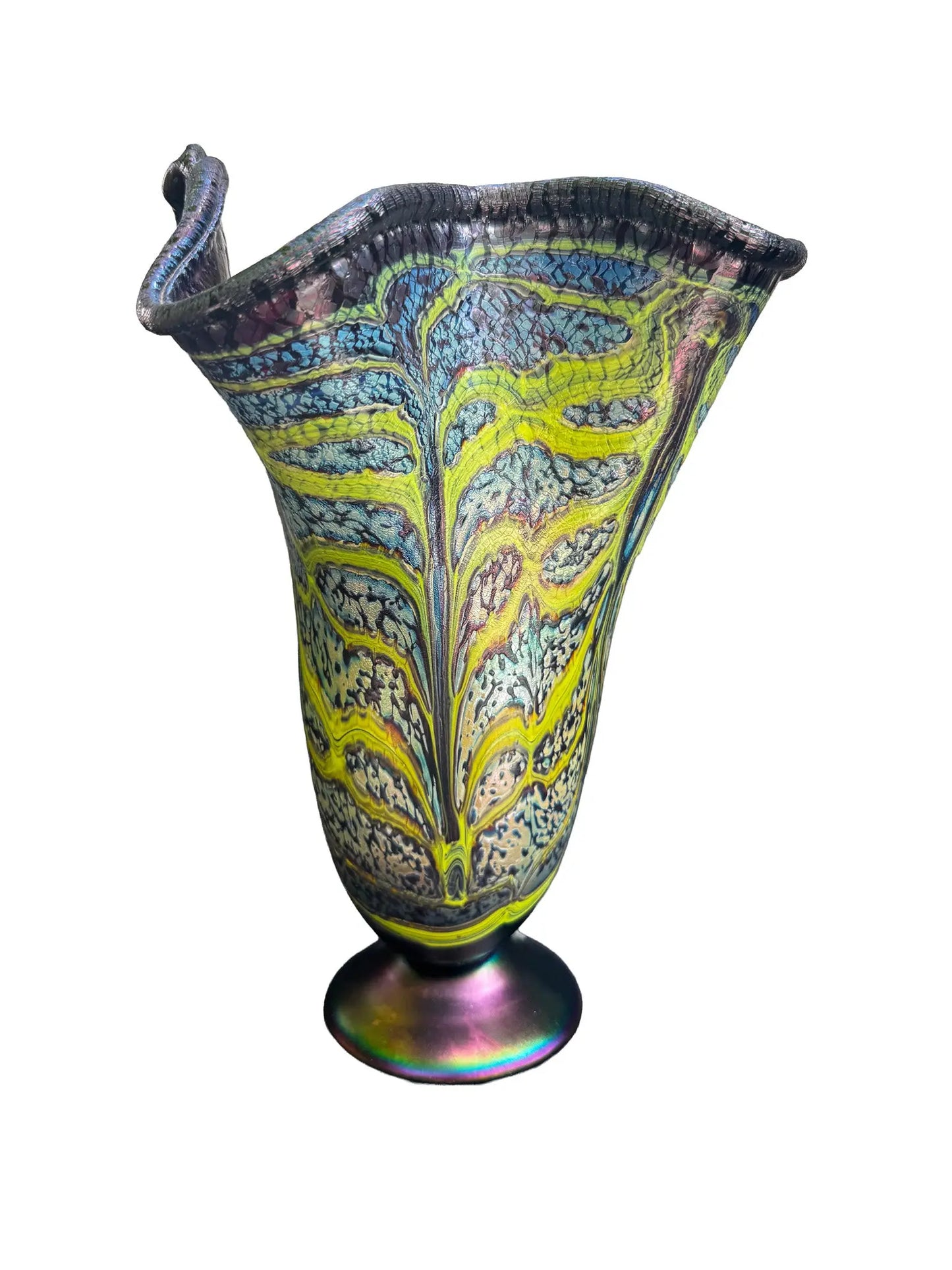 This large, fluted glass vessel, Rachel I, showcases modern craftsmanship with its opaque blue base and vivid lime green veining that meanders organically across the surface, creating a dynamic pattern reminiscent of flowing water. The fluted rim is accented by a dark, iridescent edge that shifts colors as it catches the light, reflecting hues that evoke minerals and natural elements. Its elegant design and craftsmanship make it a striking decorative piece suitable for contemporary interiors.