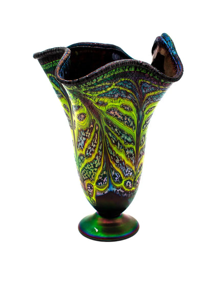 This large Rachel I glass vessel features a calming blue base with organic lime green veining and an iridescent fluted rim that shifts colors in light, reflecting mineral-like imagery. It measures approximately 10" wide by 13.5" high and weighs 3.9 lbs, showcasing modern glass artistry.
