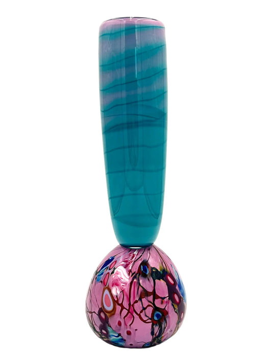 This glass art piece titled 'Cotton Candy' by Steve Palmer features a sleek turquoise body with a vibrant swirl of purple, pink, and blue at the base, blending contemporary design with craftsmanship. It can serve as a sculpture or functional vase, measuring 3" wide, 15" high, and weighing 3.7 lbs.