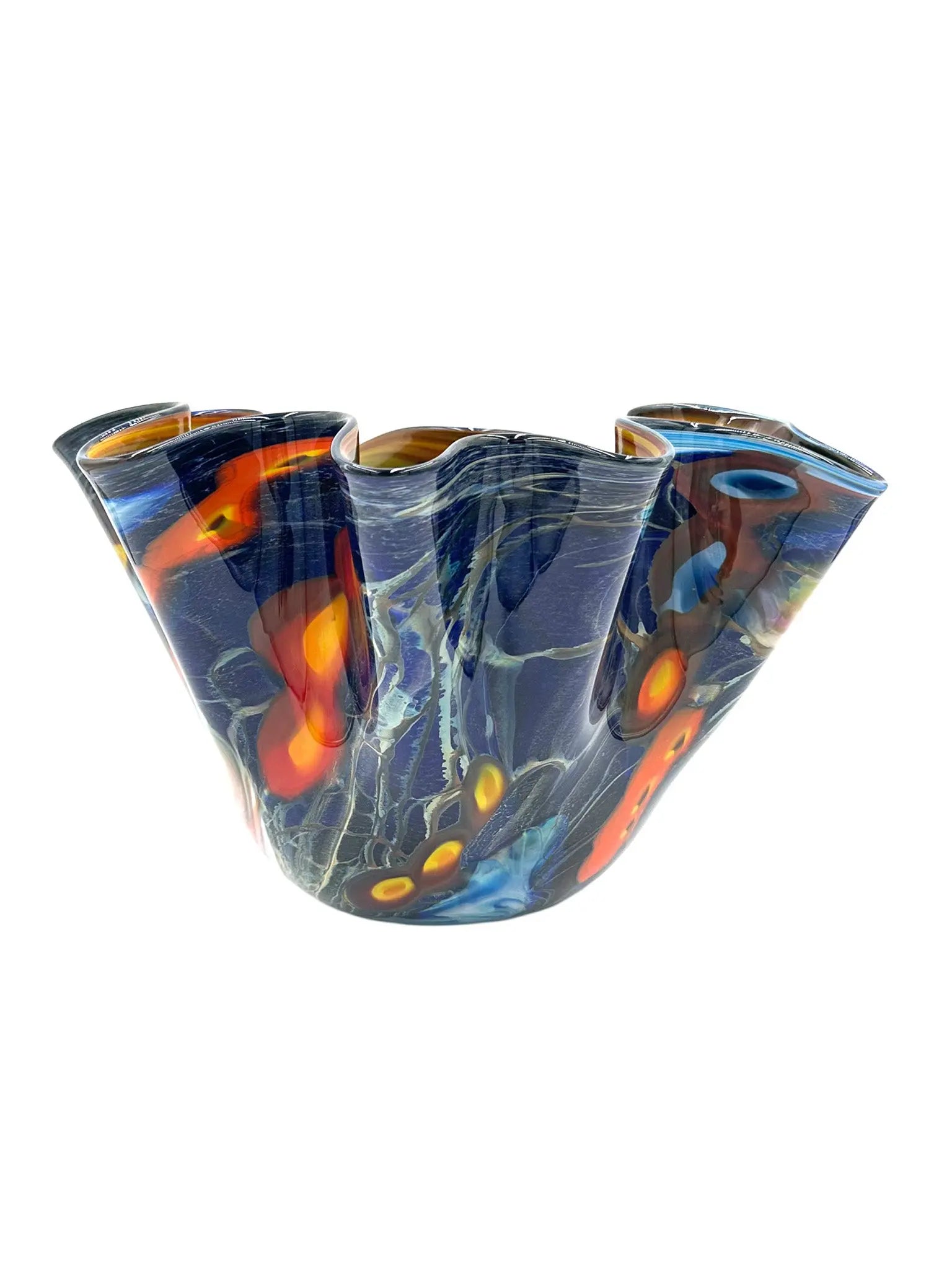 Galaxy Bowl by Steve Palmer is an elegant, handblown glass vase featuring swirling deep blue, silver, orange, and red patterns reminiscent of a cosmic dance. With a fluted rim, it combines artistry and function, ideal for striking decor or floral displays.