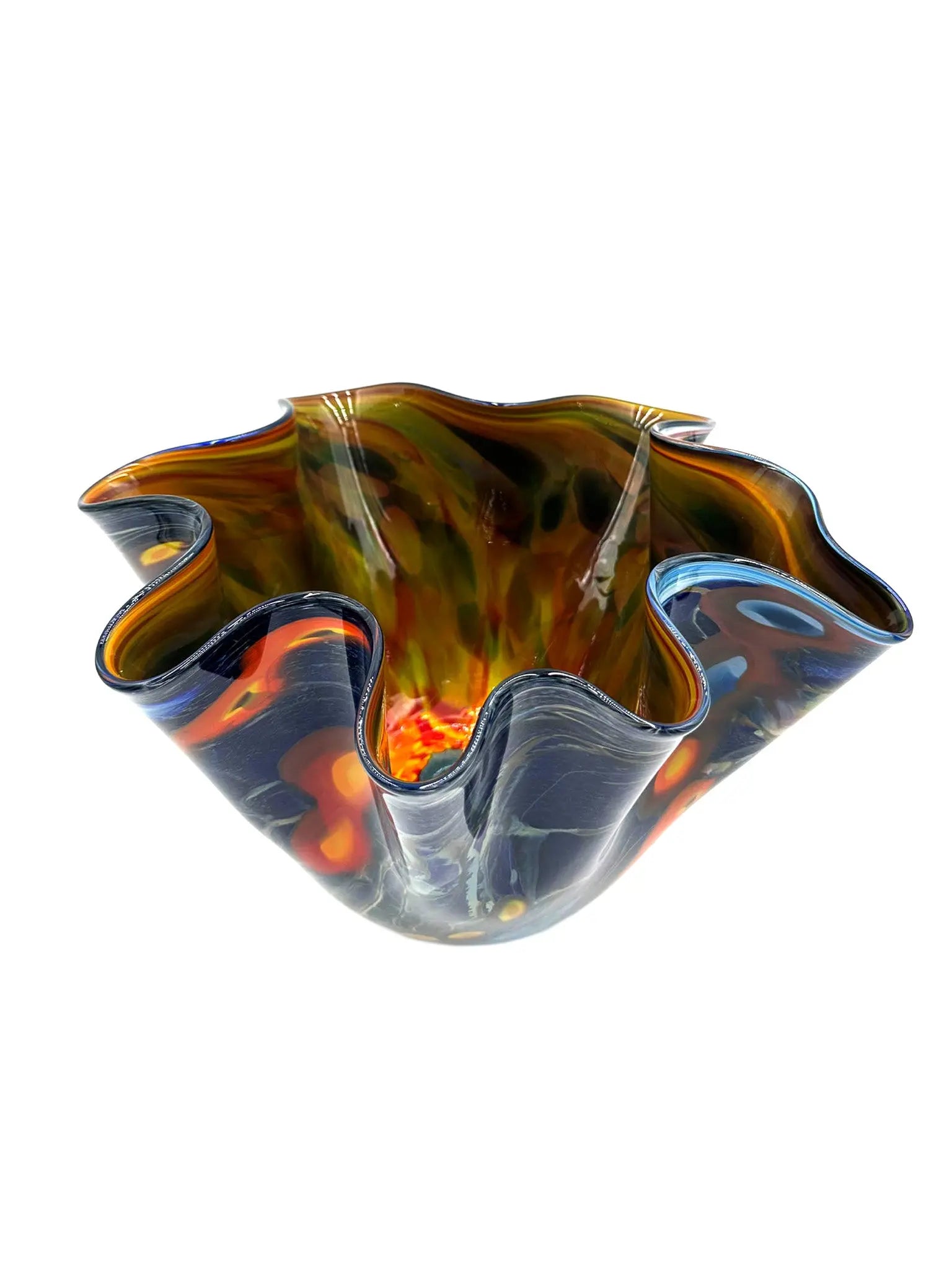 Galaxy Bowl by Steve Palmer is an elegant, handblown glass vase featuring swirling deep blue, silver, orange, and red patterns reminiscent of a cosmic dance. With a fluted rim, it combines artistry and function, ideal for striking decor or floral displays.