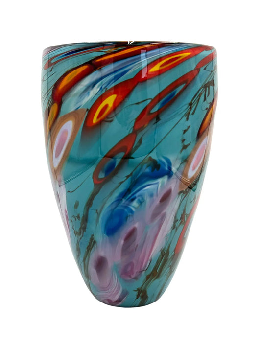 A vibrant glass vessel named Oceanic by Steve Palmer, featuring a turquoise base with abstract swirling patterns in red, orange, and yellow, inspired by flowing tides and coral reefs. The vessel measures approximately 7.75 inches wide, 12 inches tall, and 7.75 inches deep, weighing 5.95 pounds. Suitable as a sculpture or floral display.