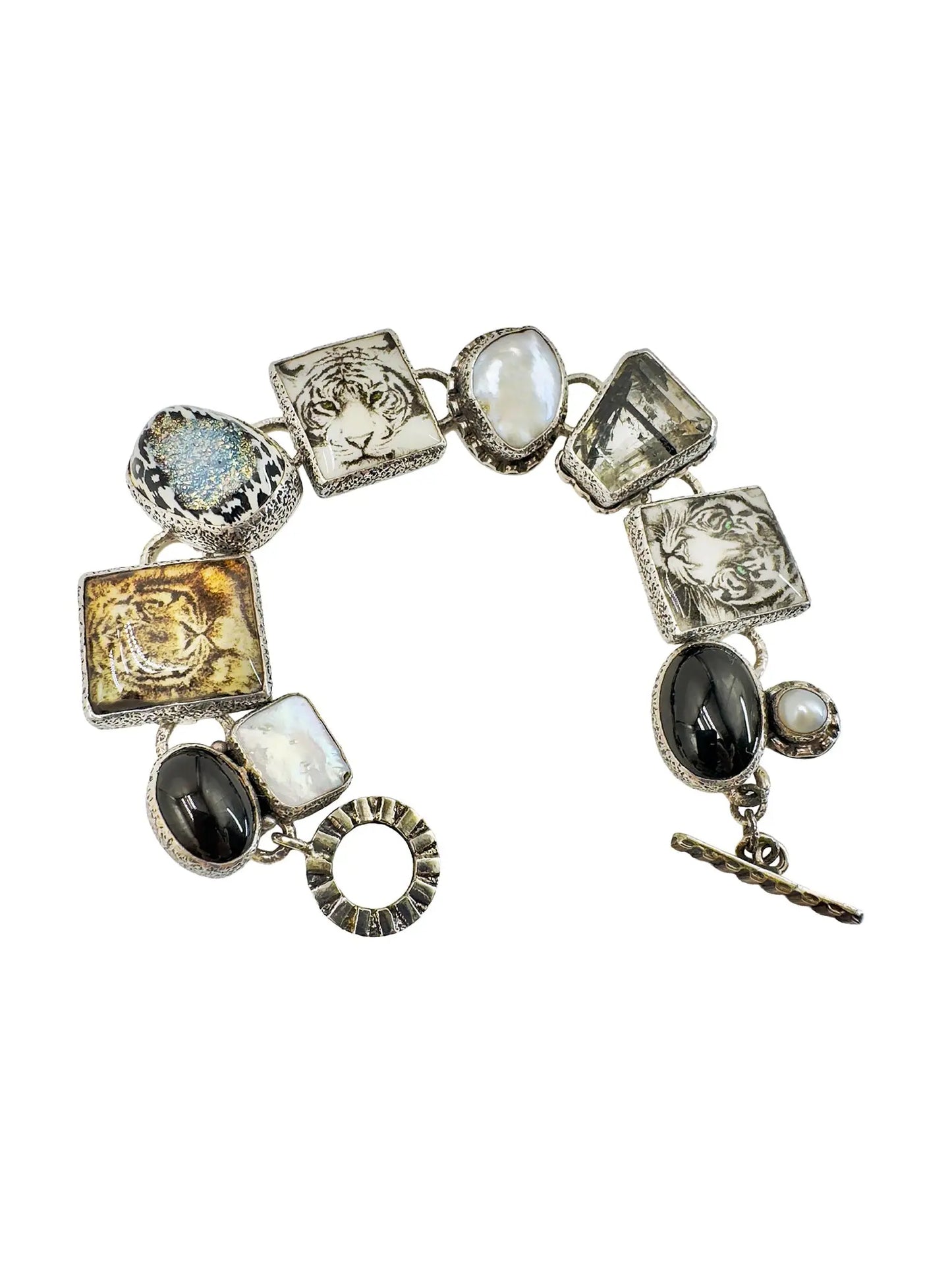 Amy Kahn Russell sterling silver station bracelet with black onyx, mabe pearls, and glass tiger face tiles.
