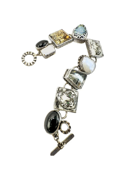 Amy Kahn Russell sterling silver station bracelet with black onyx, mabe pearls, and glass tiger face tiles.
