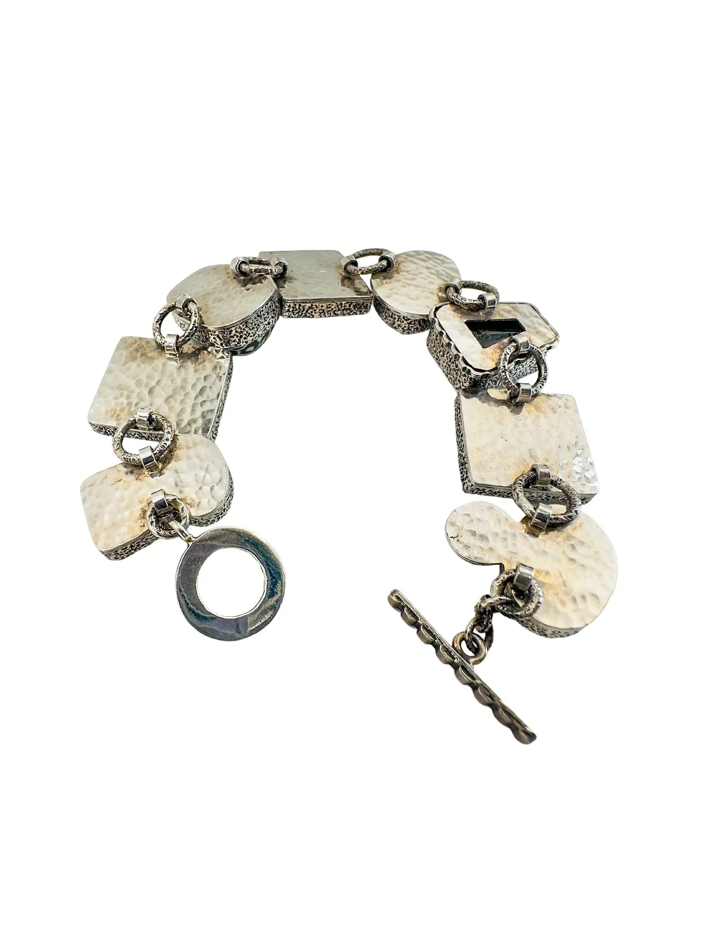 Amy Kahn Russell sterling silver station bracelet with black onyx, mabe pearls, and glass tiger face tiles.