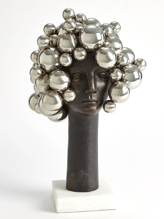 This description provides detailed information about the "Bubbles for Brains" sculpture by Global Views. The whimsical nickel bust adds humor and levity to any space, making it suitable for offices or homes. It symbolizes those overwhelmed moments when bubbles seem to float above one's head after hard work. Dimensions are approximately 13.75" long, 13" wide, and 23.25" high, with a base of 7" by 7" and weighing 24.9 lbs. A fun gift idea for tired assistants or oneself.