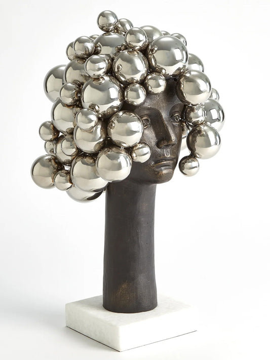 This description provides detailed information about the "Bubbles for Brains" sculpture by Global Views. The whimsical nickel bust adds humor and levity to any space, making it suitable for offices or homes. It symbolizes those overwhelmed moments when bubbles seem to float above one's head after hard work. Dimensions are approximately 13.75" long, 13" wide, and 23.25" high, with a base of 7" by 7" and weighing 24.9 lbs. A fun gift idea for tired assistants or oneself.