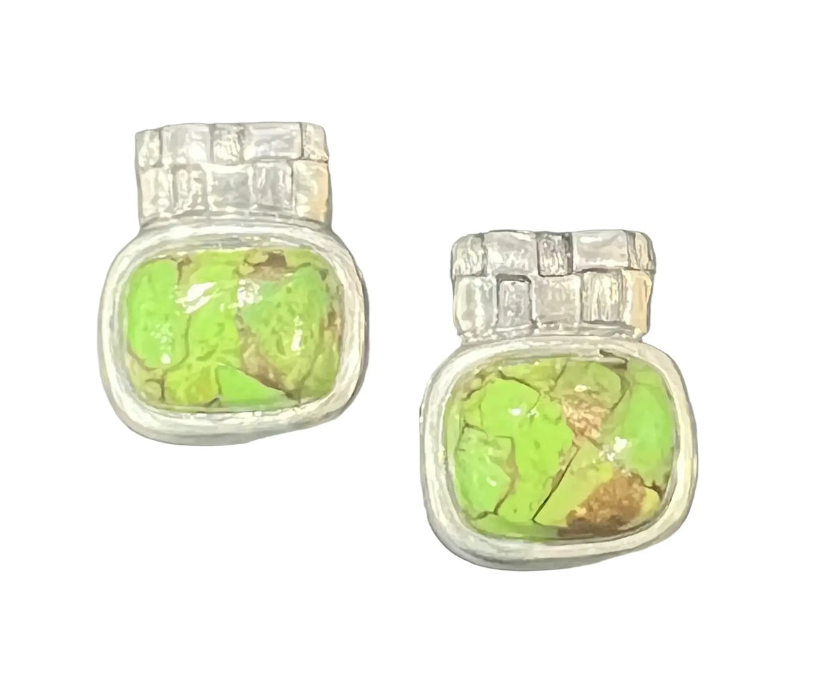 A pair of silver-toned stud earrings featuring vibrant green turquoise stones with natural brown matrix.