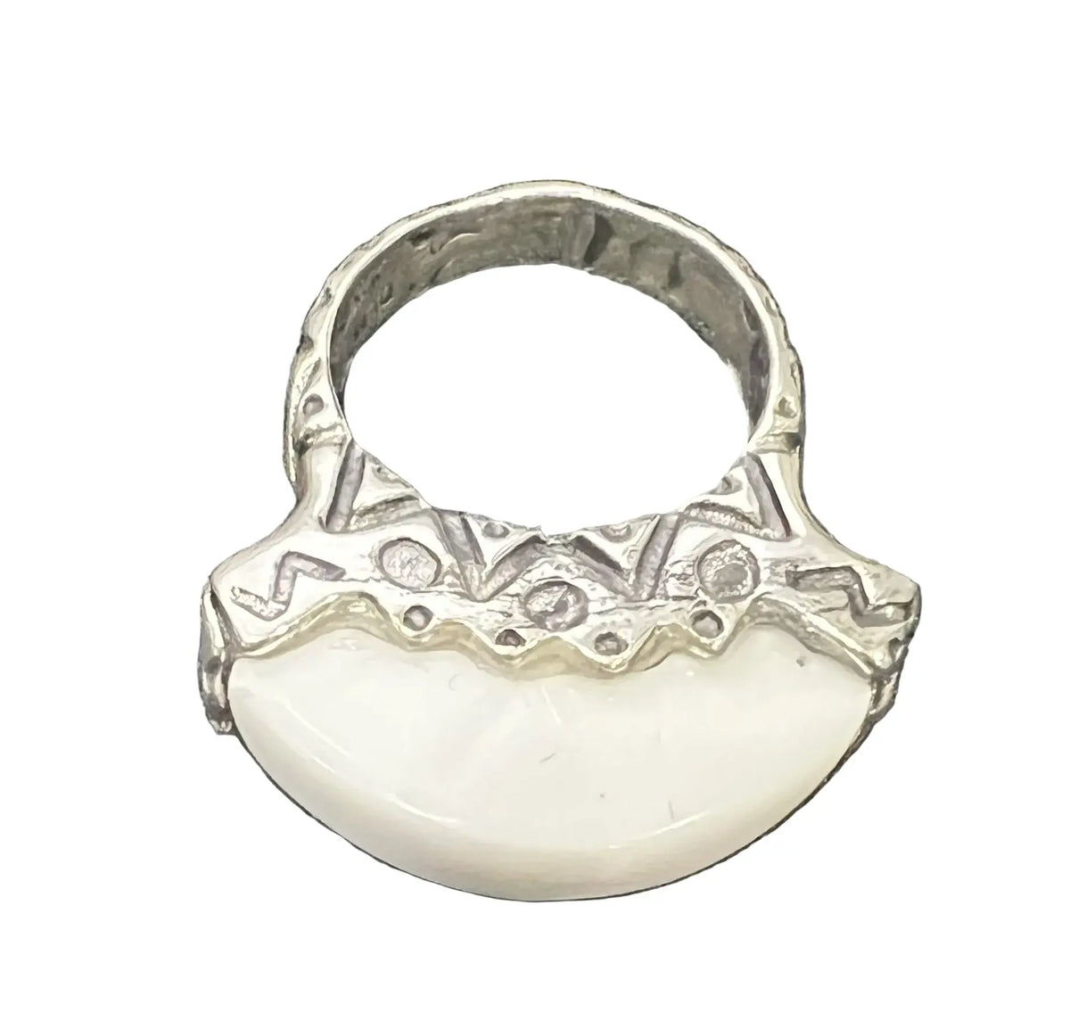 A sterling silver ring featuring a large, smooth white crescent-shaped stone or shell inlay. Wear it alone or stack it with other rings for a layered look.